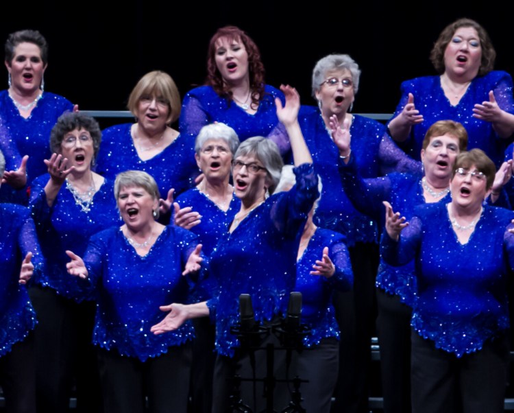 Maine-ly Harmony chorus members with director Kathy Greason centered.