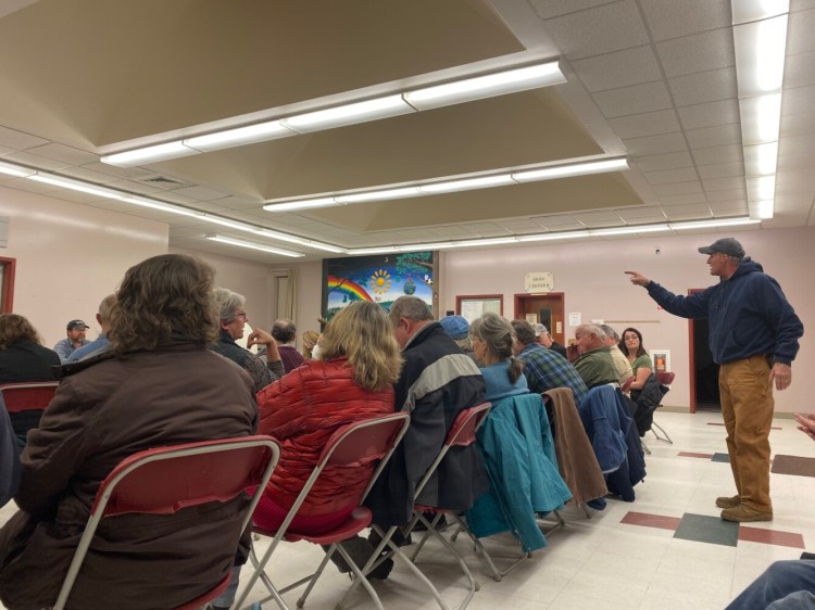 Resident Bruce Hurley confronts First Selectman Vernon Worthen at the Mercer town meeting on Nov. 21, 2019. 