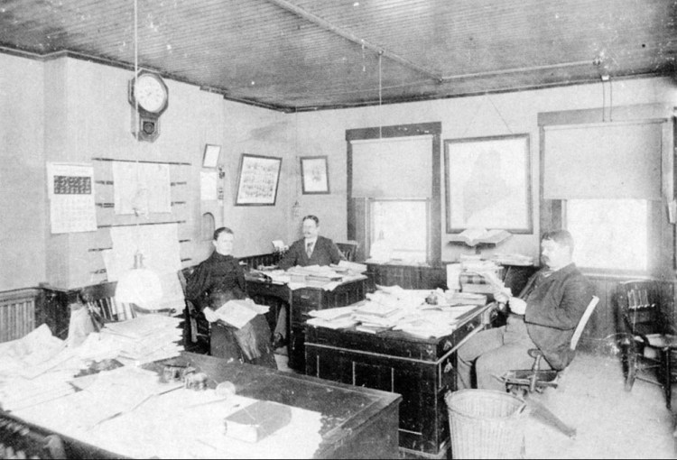 In 1870 the Kennebec Journal was located on Water Street in Augusta. A small newsroom staff occupied one room on the upper floor of the building. The newspaper was called the Daily Kennebec Journal at that time.     