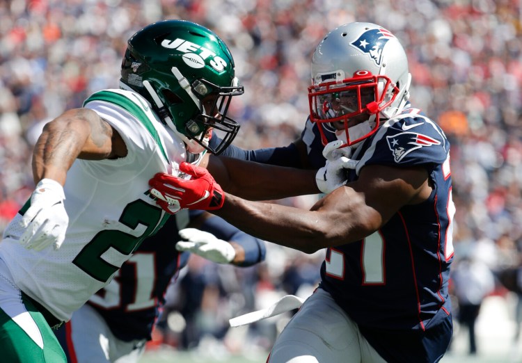 New England's J.C. Jackson blocks against the New York Jets.