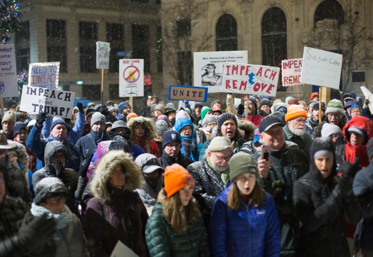 Hundreds gather in Portland's Monument Square on Tuesday evening for a rally to support the impeachment of President Trump. The U.S. House plans to take its historic impeachment vote Wednesday. Trump would be just the third president to be impeached.