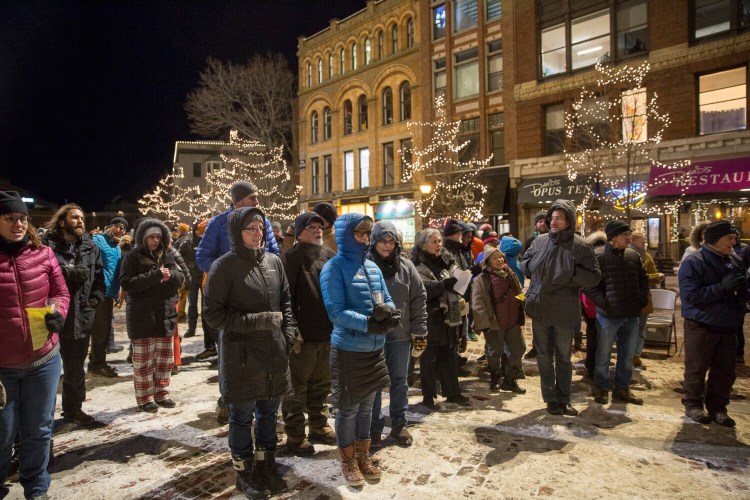 People sang "Amazing Grace" and other hymns at the end of Portland's annual vigil in Monument Square honoring the memory of homeless people who died this year.