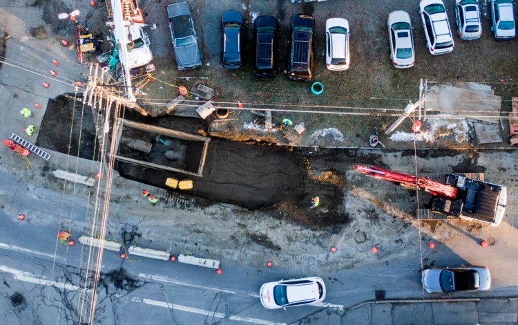 A bird's-eye view taken from a drone of the excavation and repair of 30-inch sewerage and stormwater piping that broke Nov. 29 alongside Water Street in the South End of Waterville. Crews from the Kennebec Sanitary Treatment District, Kennebec Water District, city of Waterville, Waterville Sewerage District and several contractors worked together to make the repairs and expect to wrap up the project Friday.