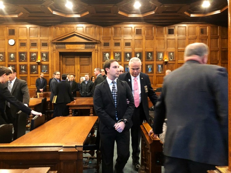 Mark Cardilli Jr. leaves a Portland courtroom in handcuffs Friday after being found guilty of manslaughter.