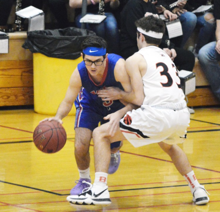 Mt. Ararat  guard Caleb Manuel, left, lowers his shoulder while being guarded by Brunswick's Thomas Harvey on Friday in Brunswick. 
