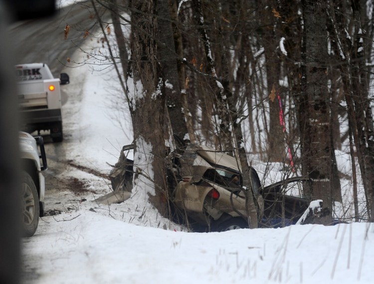A vehicle left the roadway, pictured in the background, in the vicinity of the Strickland and Pinnacle roads and smashed into a tree in Canaan on Thursday.