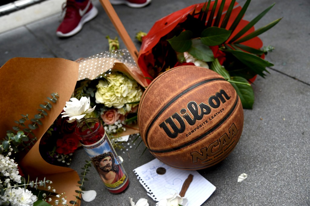 A makeshift memorial honoring former NBA basketball player Kobe Bryant appears outside of Staples center prior to the start of the 62nd annual Grammy Awards on Sunday, Jan. 26, 2020, in Los Angeles. Bryant died Sunday in a helicopter crash near Calabasas, Calif. He was 41. (AP Photo/Chris Pizzello)