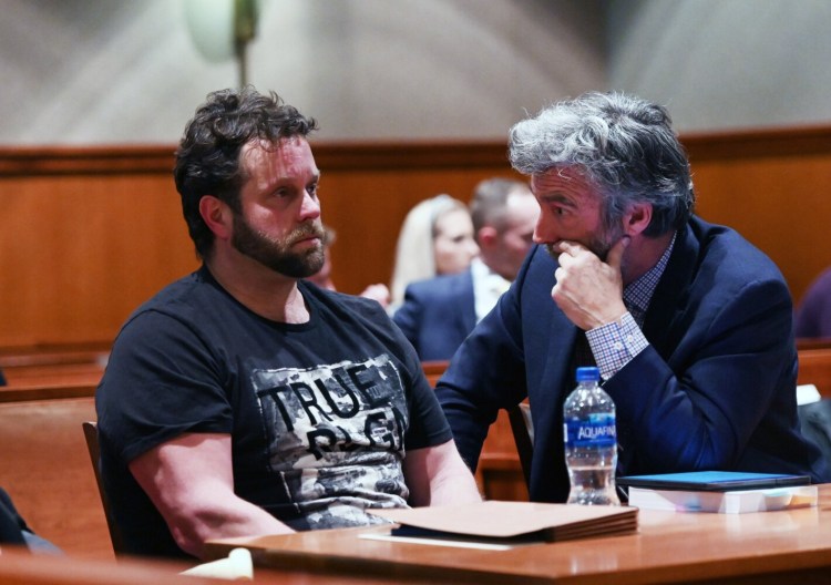 Shawn Purvis listens to his attorney, Tom Hallett, during his bail hearing Wednesday at the Cumberland County Courthouse.