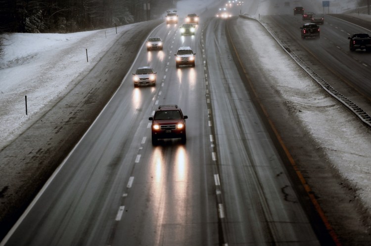Traffic moves slowly on the Maine Turnpike in Saco as icy weather hit southern Maine on Friday morning.