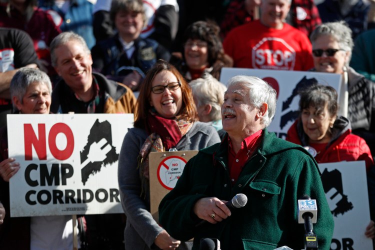 Tom Saviello speaks at a rally Monday in Augusta after a group opposed to CMP's proposed transmission line from Canada submitted more than 75,000 signatures calling for a statewide referendum on the project.