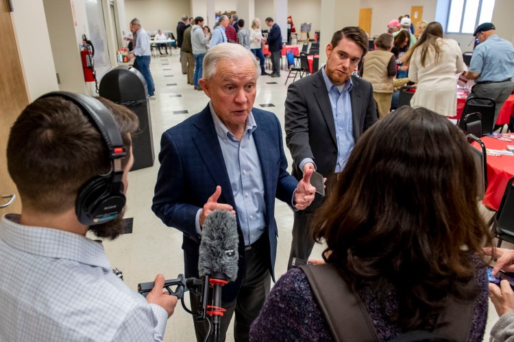 Jeff Sessions talks with the media as he campaigns at a Jefferson County GOP candidate pancake breakfast Saturday in Birmingham, Ala.