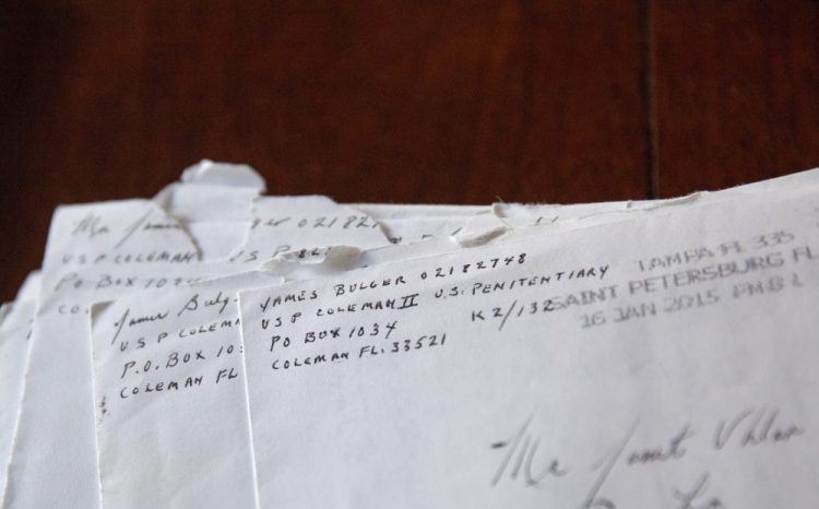Letters addressed to Janet Uhlar that she received through her correspondence with imprisoned Boston organized crime boss James "Whitey" Bulger, sit on her dining room table.