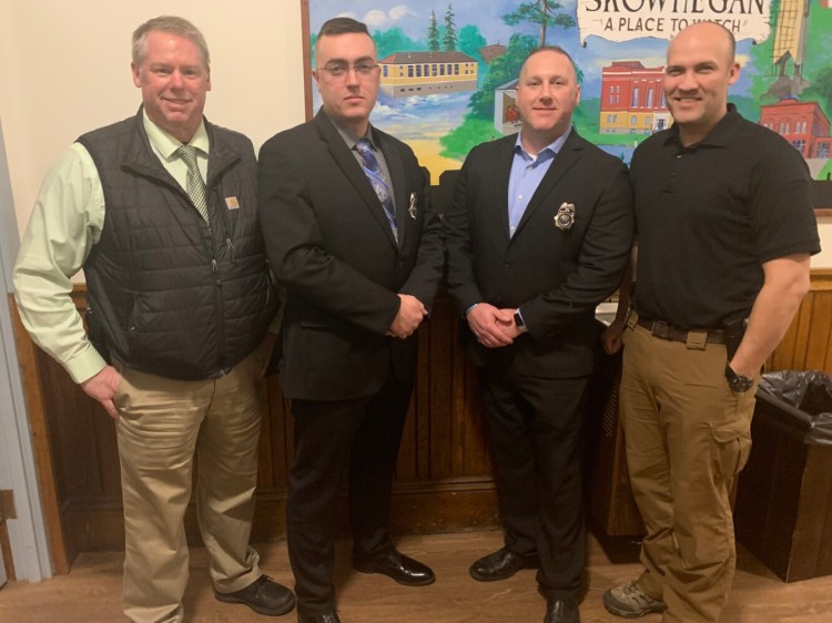 Skowhegan police Chief David Bucknam, left, swore in two officers to the Skowhegan Police Department on Tuesday night: second from left, Officer Isaac Wacome; and second from right Officer Jacob Pierce. Deputy Chief Brian Gardiner is at right.