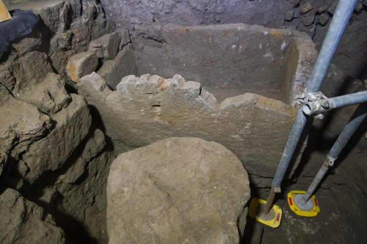 A 1.4-meter (55-inch) wide sarcophagus and what appears to be an altar, dating back to the 6th Century B.C.,  are seen in an underground chamber, at the ancient Roman Forum, during an unveiling to media, in Rome, Friday, Feb. 21.
