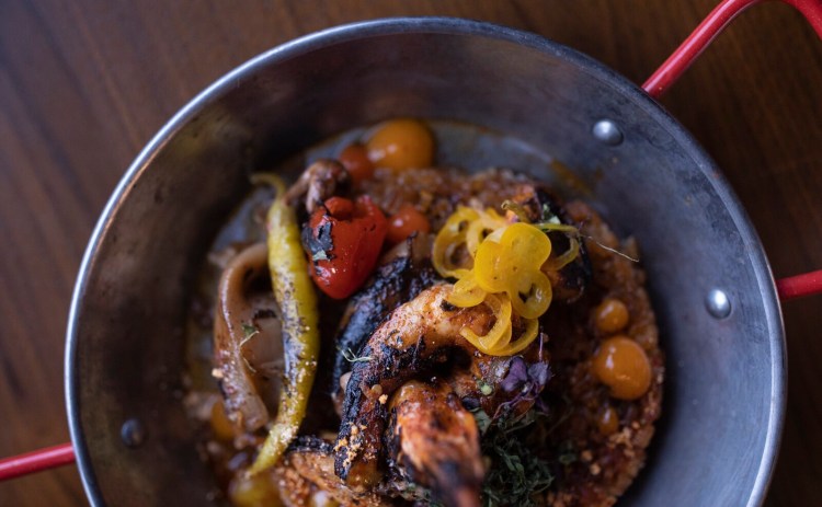 Seafood paella with mussels, octopus, squid and prawns at Anoche in Portland.  