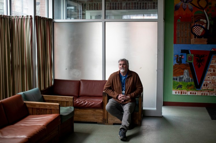 Executive Director of Preble Street Mark Swann sits for a portrait inside the teen shelter on March 17.