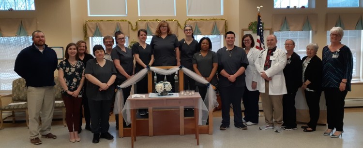 From left are Ryan Francis, Northern Light Health  administrator; Hannah Bard, Mid-Maine Regional Adult Community Education director; Keri Robichaud, Western Maine Community Action, employment & training specialist; Deborah Bubar, CNA graduate; Myles Robert, WMCA, ET specialist; Jessica Gyles, Kalynn Johnson, Crystal Rollins, Payge Shute, Trudy Turbide, Colby Moody, all CNA graduates; Patricia Shuck, NLH director of Nursing; Christopher Miller, NLH class/clinical instructor; and Desiree Knowles, NLH assistant director of Nursing; Vicki Dyer, NLH LPN; and Robin Doody, NLH talent acquisition specialist.