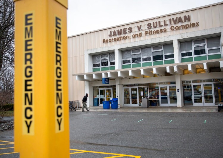 A man walks to a “wellness” center at University of Southern Maine’s Sullivan Gym, April 3.