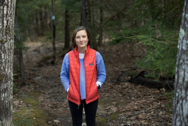 London Bernier, a soon-to-be college graduate, at her home in Falmouth on Thursday. Bernier, a environmental studies major and statistics minor, is waiting to see if her internship with a non-profit organization in Idaho will continue as planned.