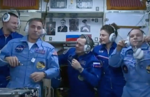 Chris Cassidy, 2nd from left, and Jessica Meir, back right on the ISS on Thursday, April 9.