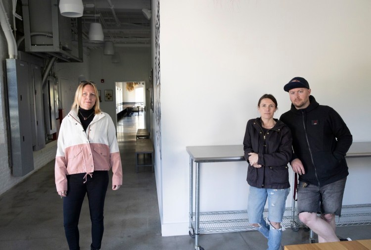 Carrie Blakeman, left, of Rogers Collection in Yarmouth and Christian and Christine Hayes, owners of The Garrison restaurant and Dandelion Catering. Blakeman has been working with local businesses that have been hit with a 25 percent tariff, trying to get the tariff lifted during the pandemic.