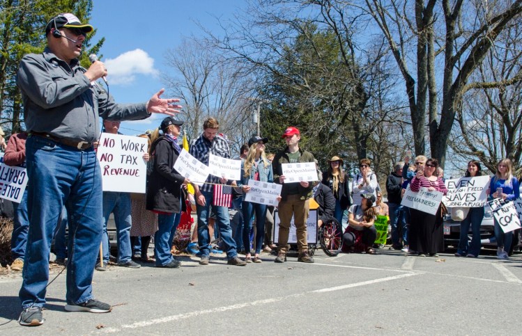 Jay Allen, 1st District congressional candidate, speaks Saturday during a reopen the state rally between the Blaine House and the Maine State House in Augusta. 
