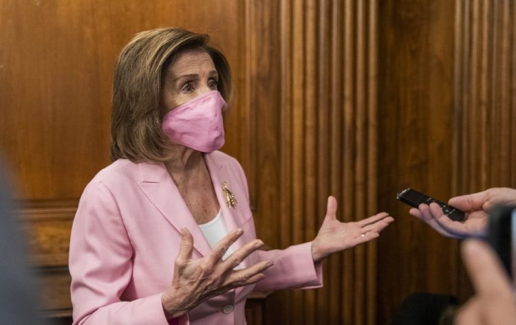 House Speaker Nancy Pelosi of California talks to reporters on Capitol Hill on Tuesday in Washington. Pelosi has outlined governors' requests for $500 billion, with the counties and cities seeking as much as $300 billion, which she has said could be spread out over the next several years. 