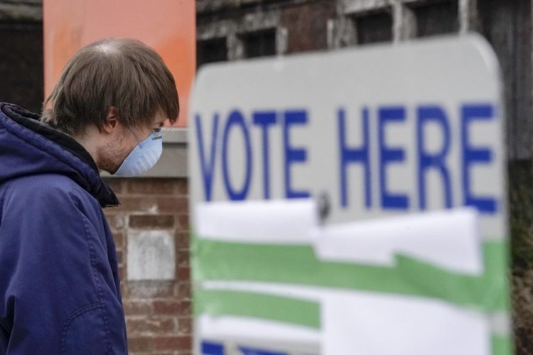 Voters line up at Riverside High School for Wisconsin's primary election April 7 in Milwaukee. 