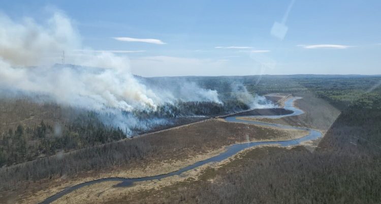 Maine Forest Rangers posted this photo in a tweet on Thursday at a time when they reported the brush fire at Island Falls was growing near May Mountain and was threatening several camps. 