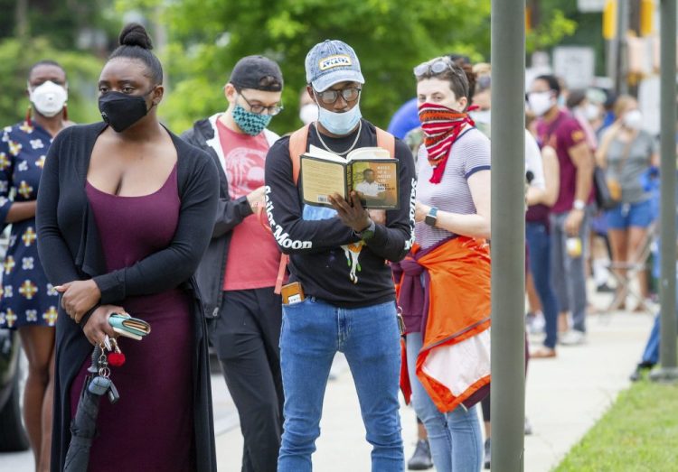 Voters wait in a line that stretched around the Metropolitan Library in Atlanta, Georgia, on Tuesday. 