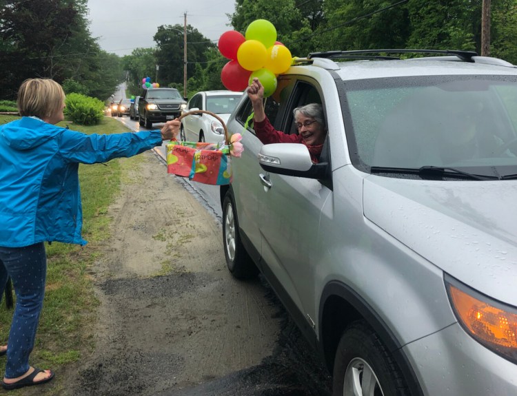 Susan Burleigh, left,  accepting cards from Pam Chenea, Wayne Aging at Home director.