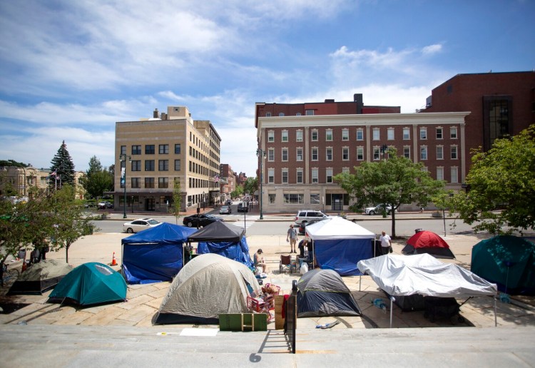 Tents are set up in front of City Hall in Portland, as homeless people and activists continue to use the space for a third day on Friday.