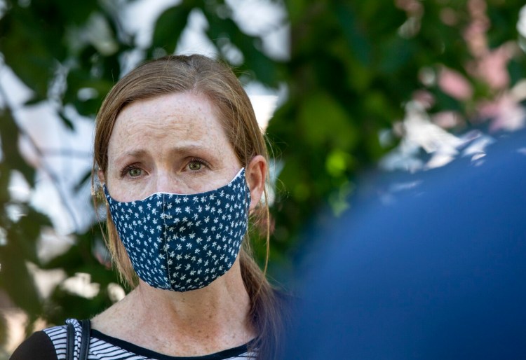 Mayor Kate Snyder's eyes begin to well up with tears as she speaks with members of the media alongside Fire Chief Keith Gautreau after listening session with protesters from City Hall on Wednesday. The meeting was held to hear out the organizers, participants and allies who are holding the tent-out outside of City Hall.