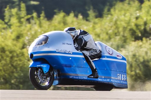 Bill Warner makes a run on his motorcycle during The Maine Event on a runway at the former Loring Air Force Base in Limestone on July 14, 2013. Warner, 44, of Wimauma, Fla., died that day after losing control and zooming off a runway on a later run. 