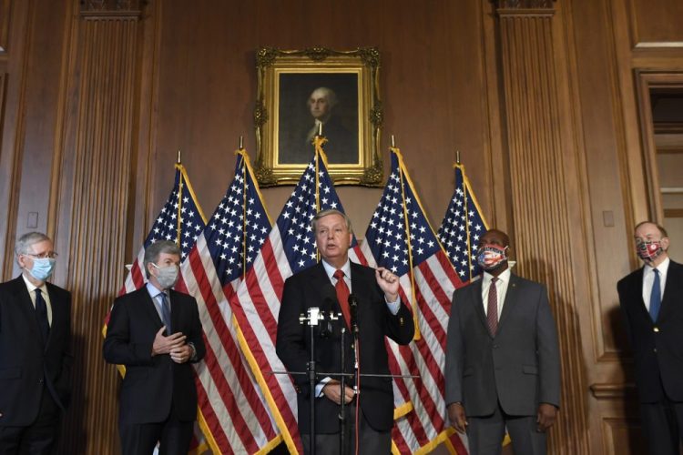 Sen. Lindsey Graham, R-S.C., center, speaks during a news conference on on Capitol Hill in Washington on Monday to highlight the Republican proposal for the next coronavirus stimulus bill. Joining Graham, from left, is Senate Majority Leader Mitch McConnell of Ky., Sen. Roy Blunt, R-Mo., Sent. Tim Scott, R-S.C., and Sen. Richard Shelby, R-Ala. (AP Photo/)