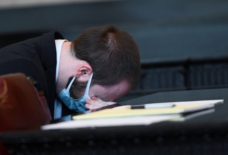 PORTLAND, ME - AUGUST 31: Mark Cardilli Jr. puts his head down and wipes his eyes after his sister Chelsey Cardilli spoke during his sentencing at the Cumberland County Courthouse Monday, August 31, 2020.  Mark Cardilli Jr., admitted shooting 22-year-old Isahak Muse during a family fight. (Staff Photo by Shawn Patrick Ouellette/Staff Photographer)