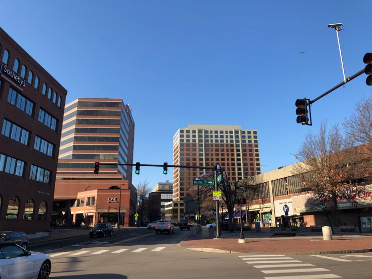 This digital rendering shows a proposed 18-story apartment building, right of center. It is taller than any existing building in Portland, include the 13-story One Center Center at left of center in this image.