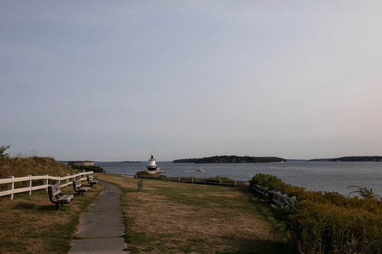 Smoke from the Western wildfires creates a haze that resembles overcast skies, seen from Spring Point Ledge Light on Wednesday. Despite the smoke, Maine's air quality remains good, according to the DEP.