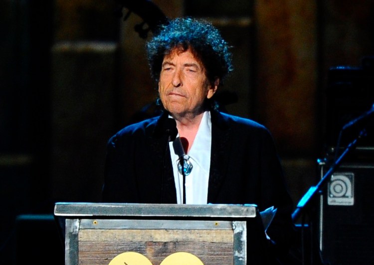 FILE - In this Feb. 6, 2015 file photo, Bob Dylan accepts the 2015 MusiCares Person of the Year award at the 2015 MusiCares Person of the Year show in Los Angeles. The latest volume of Dylan's bootleg series, a six-disc box set being released Friday presents everything Dylan recorded for his milestone 1975 album "Blood on the Tracks." (Photo by Vince Bucci/Invision/AP, File)