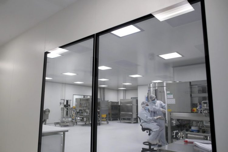 Laboratory technicians work at the mAbxience biopharmaceutical company on an experimental coronavirus vaccine developed by Oxford University and the laboratory AstraZeneca in Garin, Argentina, this month. AstraZeneca announced Monday that its vaccine candidate has entered the final testing stage in the U.S. 