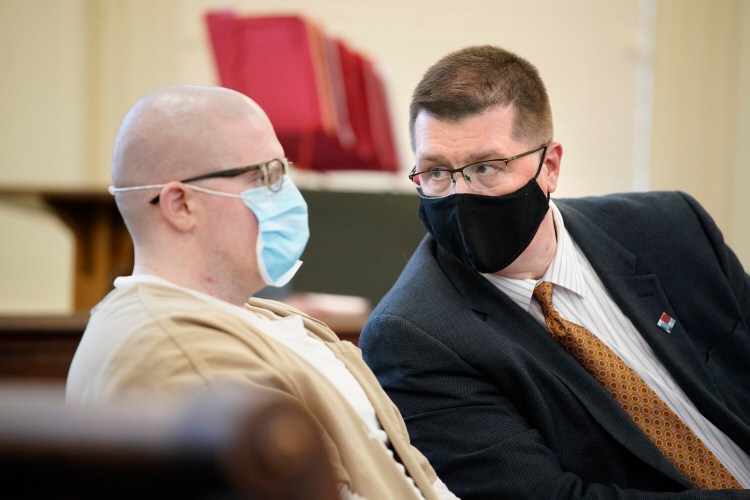 Joseph Mekonis, attorney for Dustan Bentley, speaks with his client during his sentencing hearing in York County Superior Court in Alfred in October. 