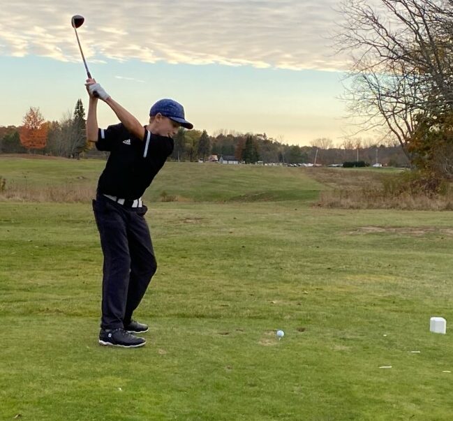 Eli Spaulding of Freeport gears up for a drive on the ninth hole during a match against Greely earlier this season at Freeport Country Club.