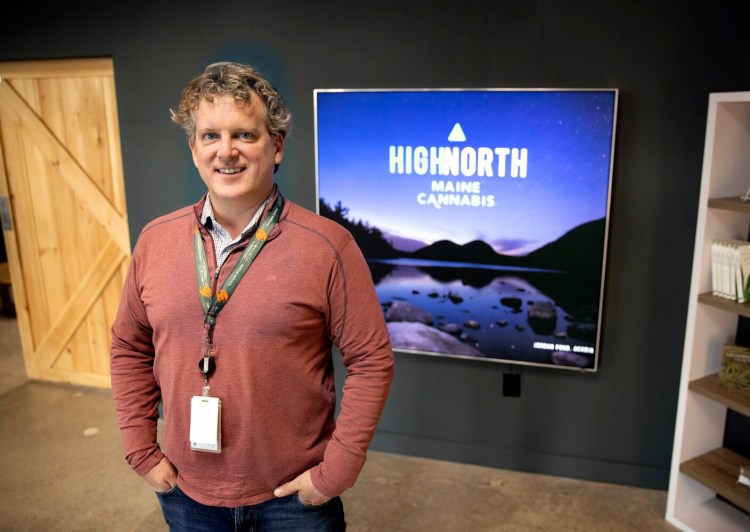 SOUTH PORTLAND, ME - NOVEMBER 20:  Wellness Connection of Maine, the state's largest medical marijuana company, is converting to recreational marijuana will open its first retail store on Monday. Managing Director Charlie Langston stands in front of a sign promoting the new brand, Highnorth Maine Cannabis. (Staff photo by Derek Davis/Staff Photographer)