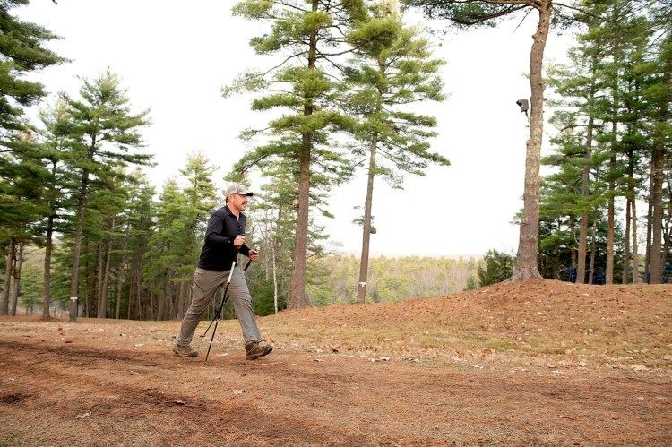 Kevin Morissette of Lewiston hikes to the top of Lost Valley in Auburn for his 46th time within 10 hours on Nov. 20, 2020. Morissette aimed to hike 24,725 feet of elevation gain within 36 hours to raise money for Tree Street Youth.