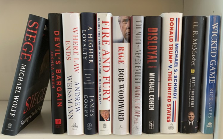 A collection of books about President Trump, from left, "Siege" by Michael Wolff, "Devil's Bargain" by Joshua Green, "Where Law Ends" by Andrew Weissmann, "A Higher Loyalty: Truth, Lies, and Leadership" by James Comey, "Fire and Fury: Inside the Trump White House" by Michael Wolff, "Rage" by Bob Woodward, "Too Much and Never Enough" by Mary L. Trump, "Disloyal" by Michael Cohen, "Donald Trump V. The United States" by Michael S. Schmidt, "Battlegrounds: The Fight to Defend the Free World" by H. R. McMaster and "Wicked Game" by Rick Gates. 