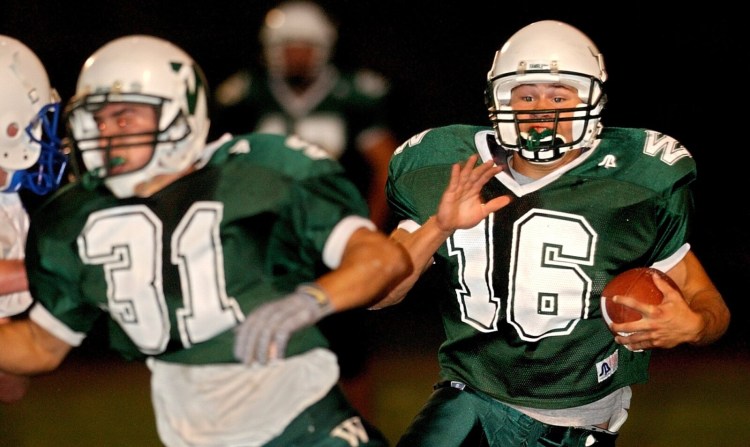 Staff file photo / JOE PHELAN
Winthrop High School's Tavis Hasenfus, right, looks for an open hole against Madison Area Memorial High School in September.