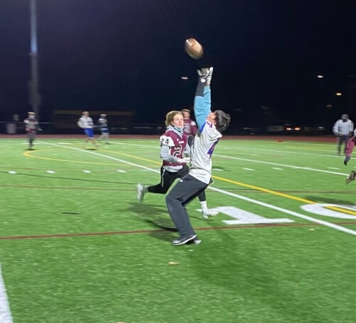 Mt. Ararat's Shea Farrell, front, hauls in a pass while Freeport's Daniel Casale  defends during a 7-on-7 game earlier this season in Freeport.