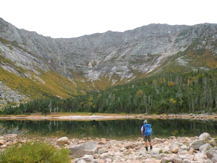 This is a view of the high walls of Great Basin, including Knife Edge and Baxter Peak from Chimney Pond, at Mount Katahdin, taken in 2020. A hiker was injured when he fell between rocks on the Great Basin.