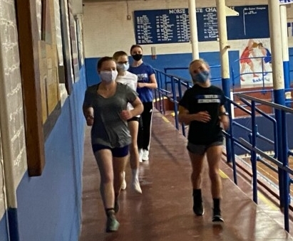 The Morse indoor track team warms up for a skills and drills session on Monday at Morse High School in Bath.