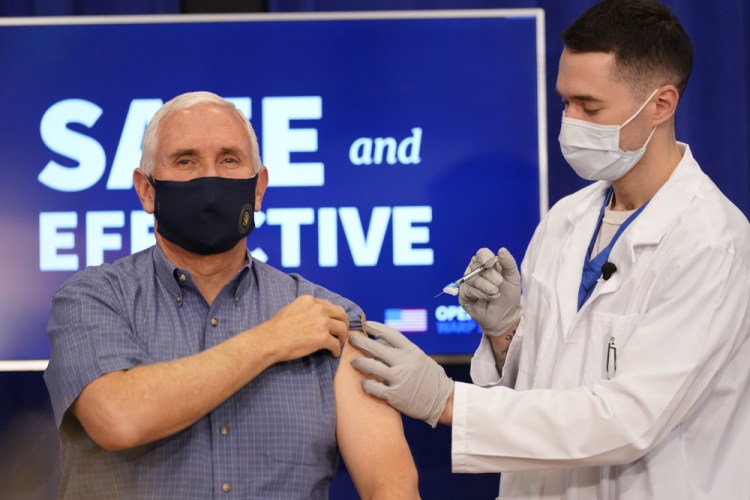 Vice President Mike Pence receives a Pfizer-BioNTech COVID-19 vaccine shot at the Eisenhower Executive Office Building on the White House complex, Friday, Dec. 18, in Washington.  Karen Pence, and U.S. Surgeon General Jerome Adams also participated. 